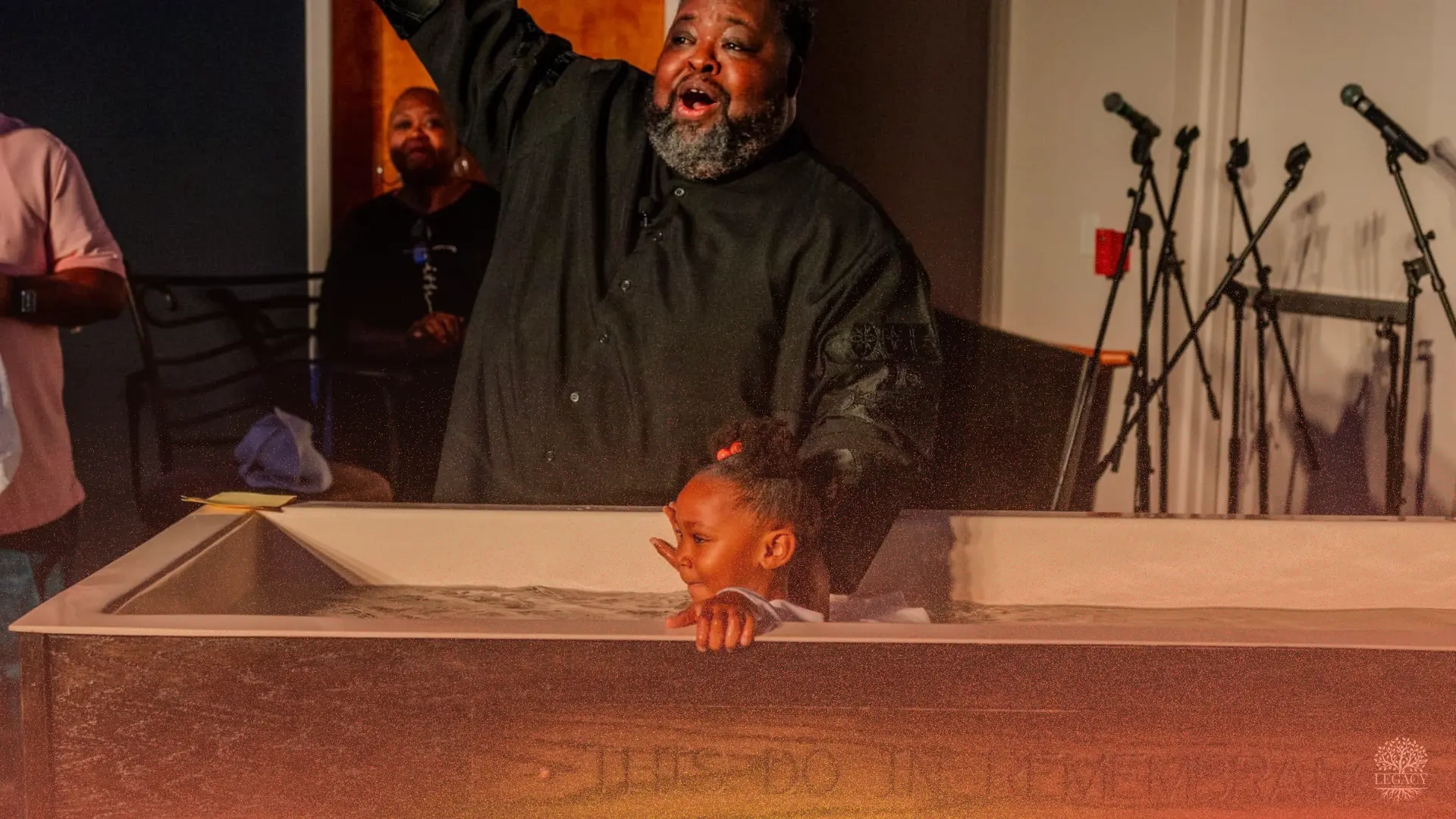 A young girl being baptized at DelVal Church